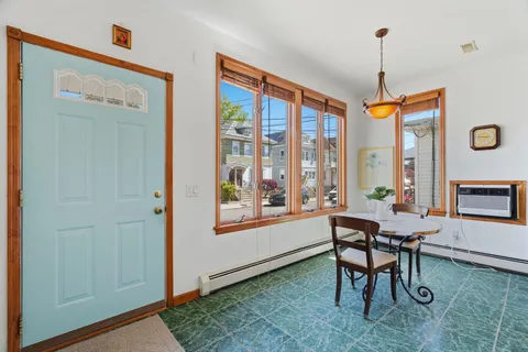 a workspace room with furniture and a window