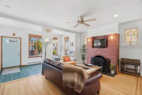 a living room with furniture and a fireplace