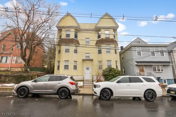 a car parked in front of a house