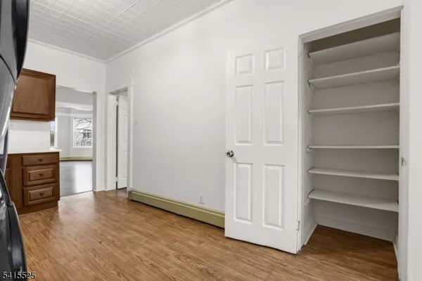a view of a livingroom with furniture and wooden floor