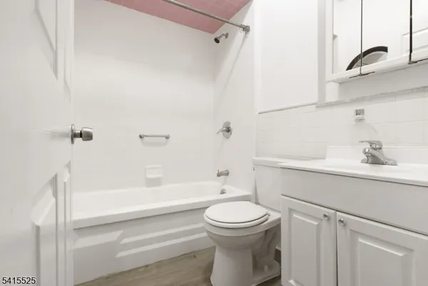 a bathroom with a sink a toilet and a bathtub