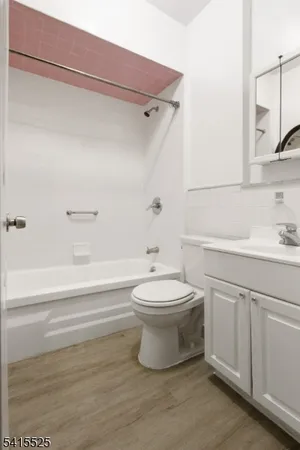a bathroom with a toilet sink and bathtub