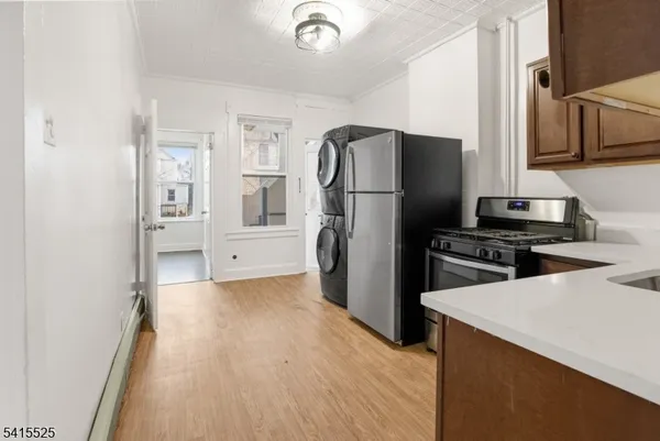 a kitchen with a refrigerator and a sink