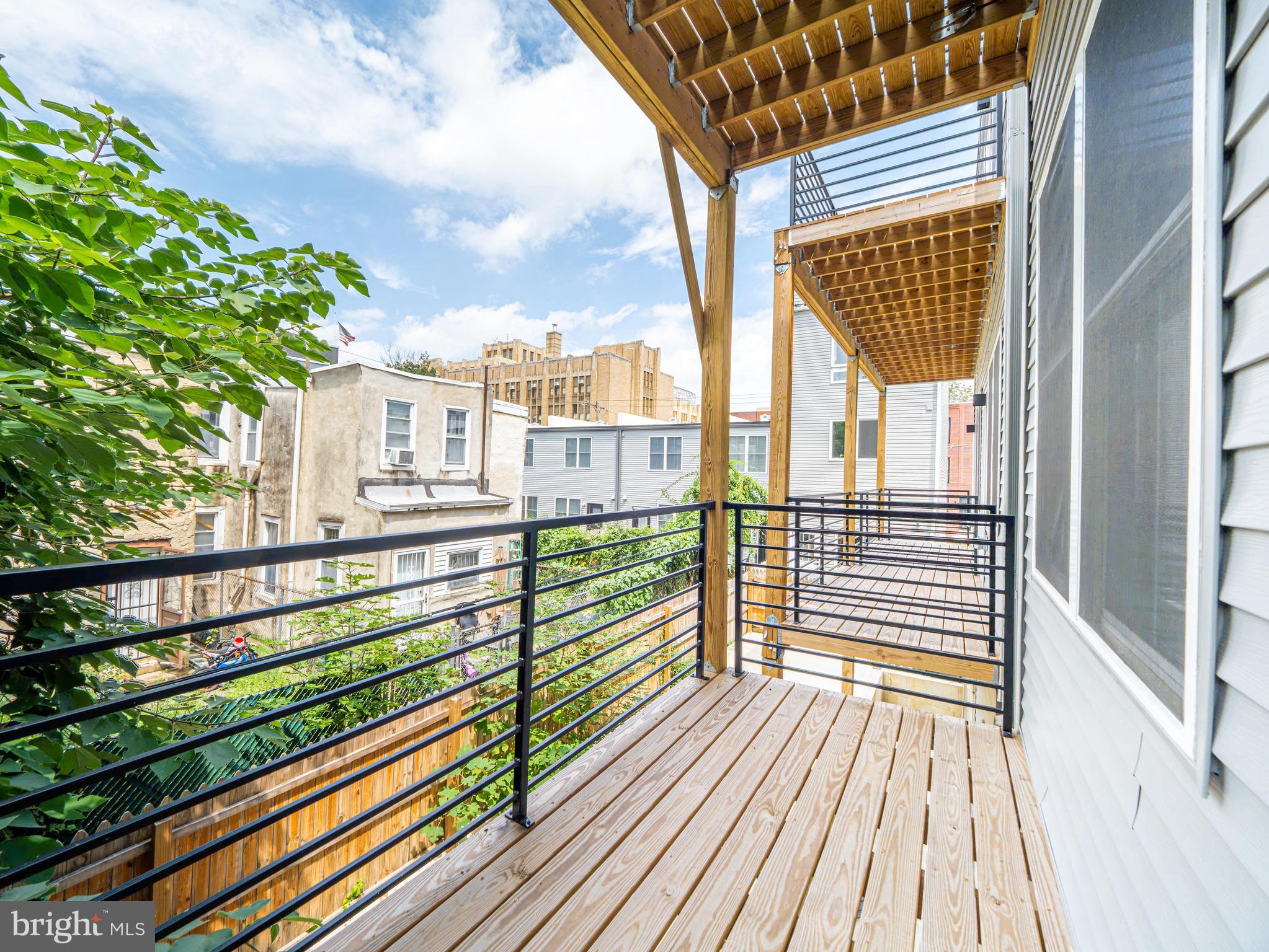 2403-2407 West Thompson Street, Unit 3 Philadelphia, PA 19121 - Photo 11 of 13 a view of a balcony with wooden floor