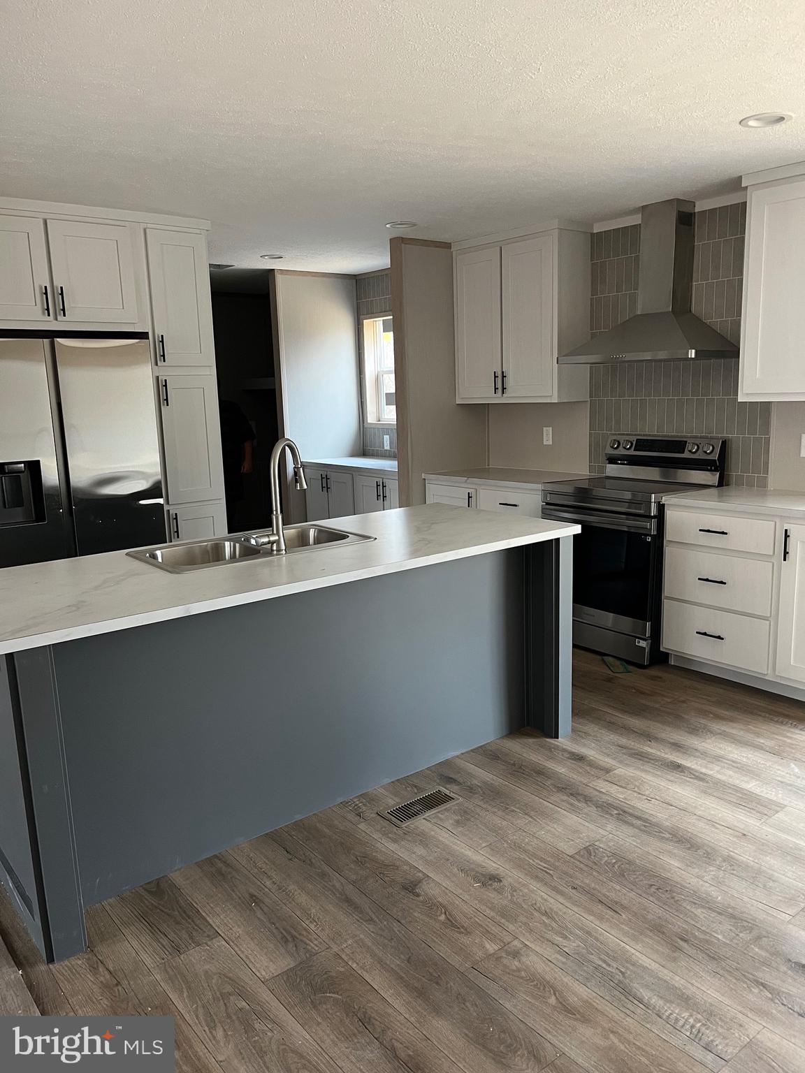 334 Opal Road Millville, NJ 08332 - Photo 7 of 15 a kitchen with a sink cabinets and window