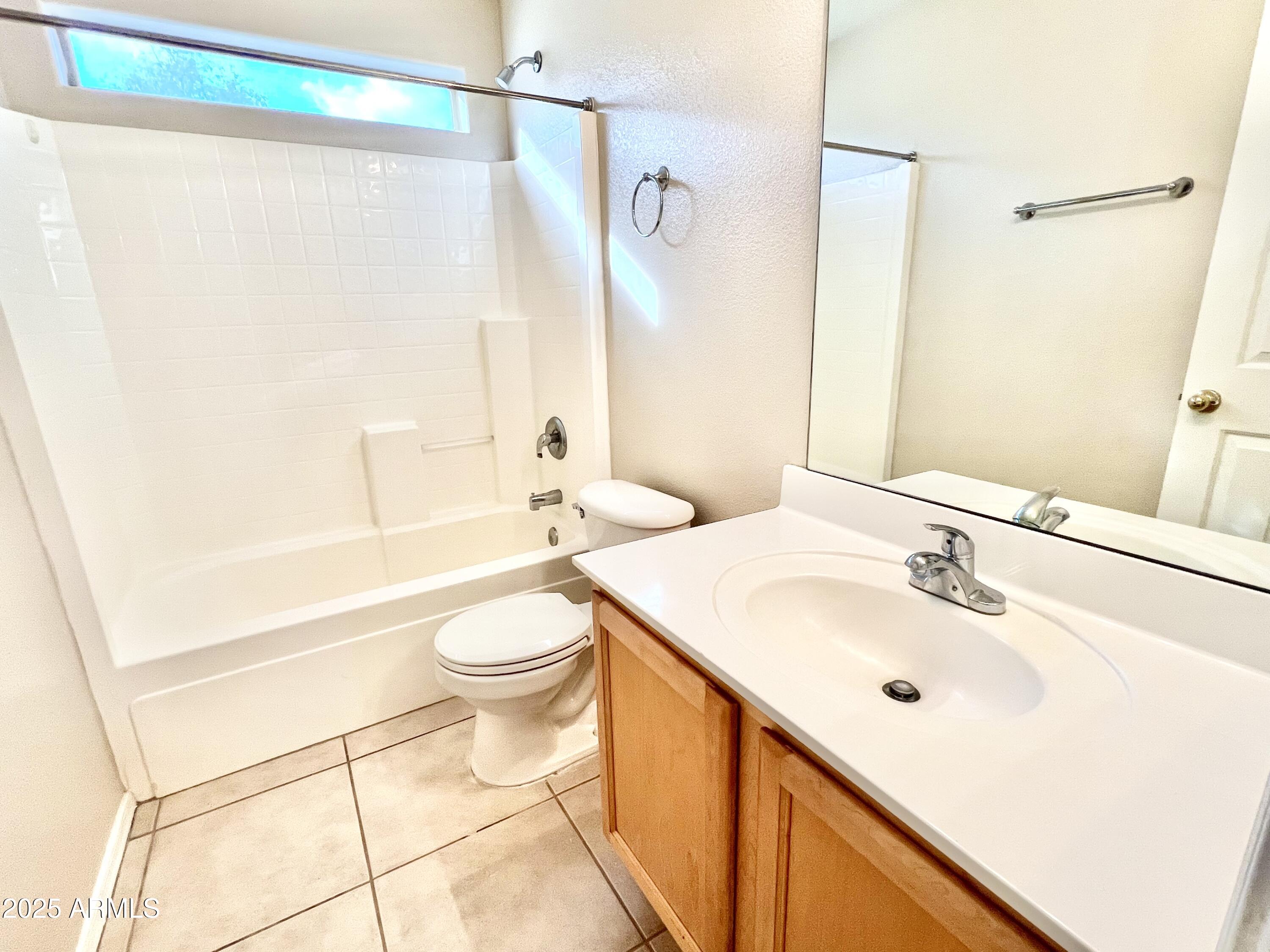 7309 West Mohawk Lane Glendale, AZ 85308 - Photo 16 of 24 a bathroom with a sink a toilet and shower