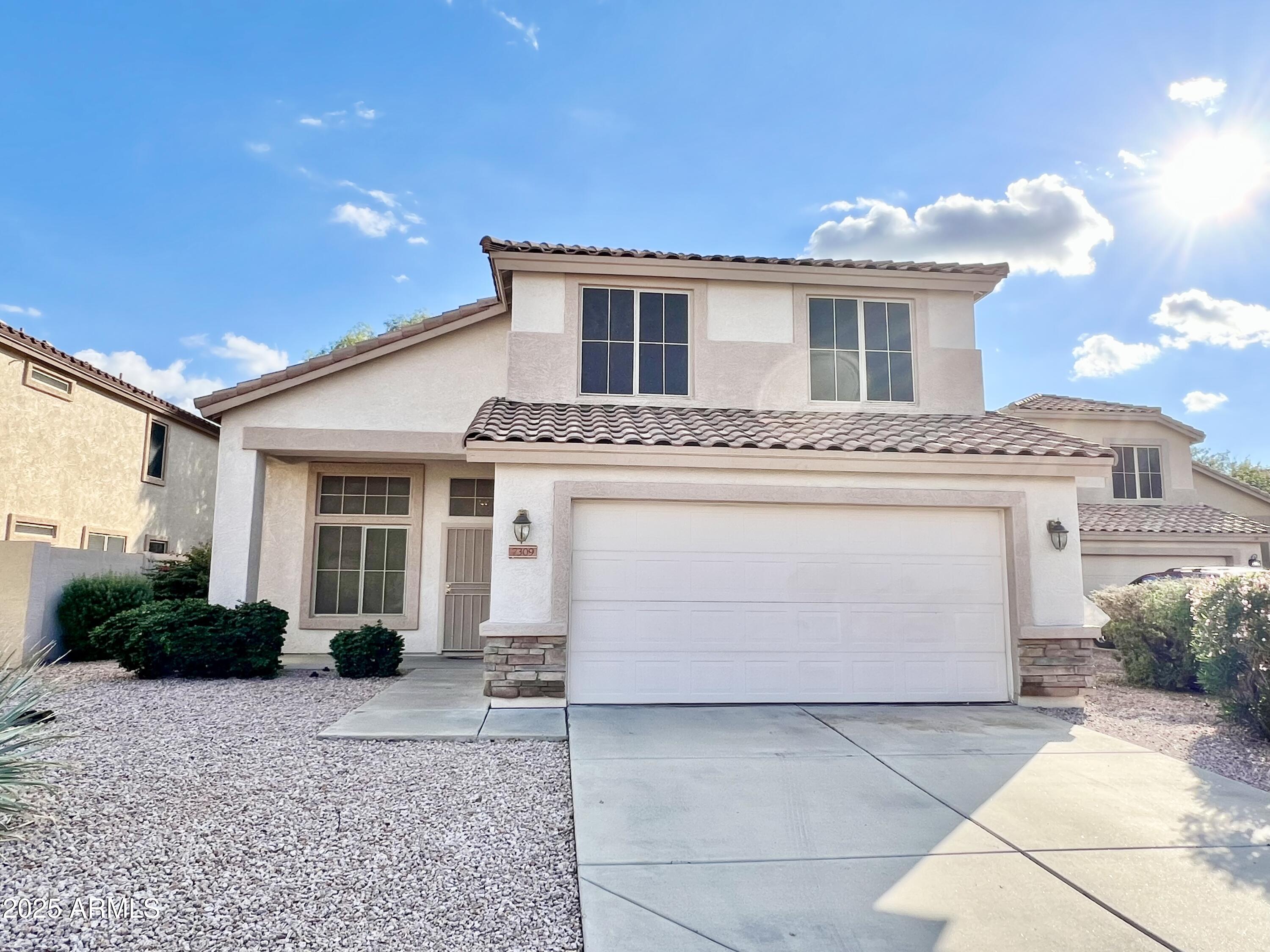7309 West Mohawk Lane Glendale, AZ 85308 - Photo 2 of 24 a front view of a house with a yard