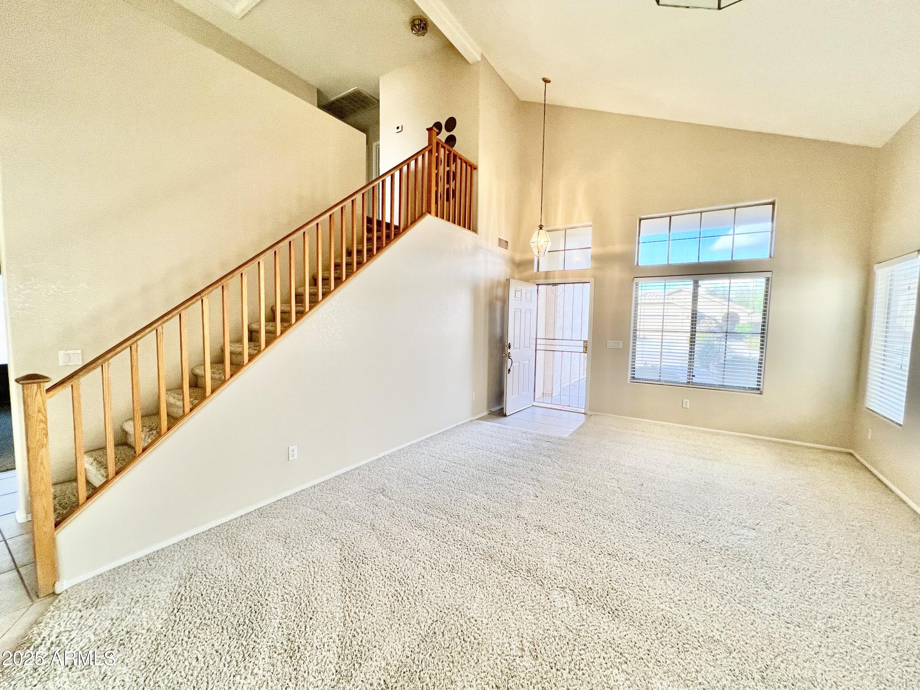 7309 West Mohawk Lane Glendale, AZ 85308 - Photo 9 of 24 a view of an entryway with staircase