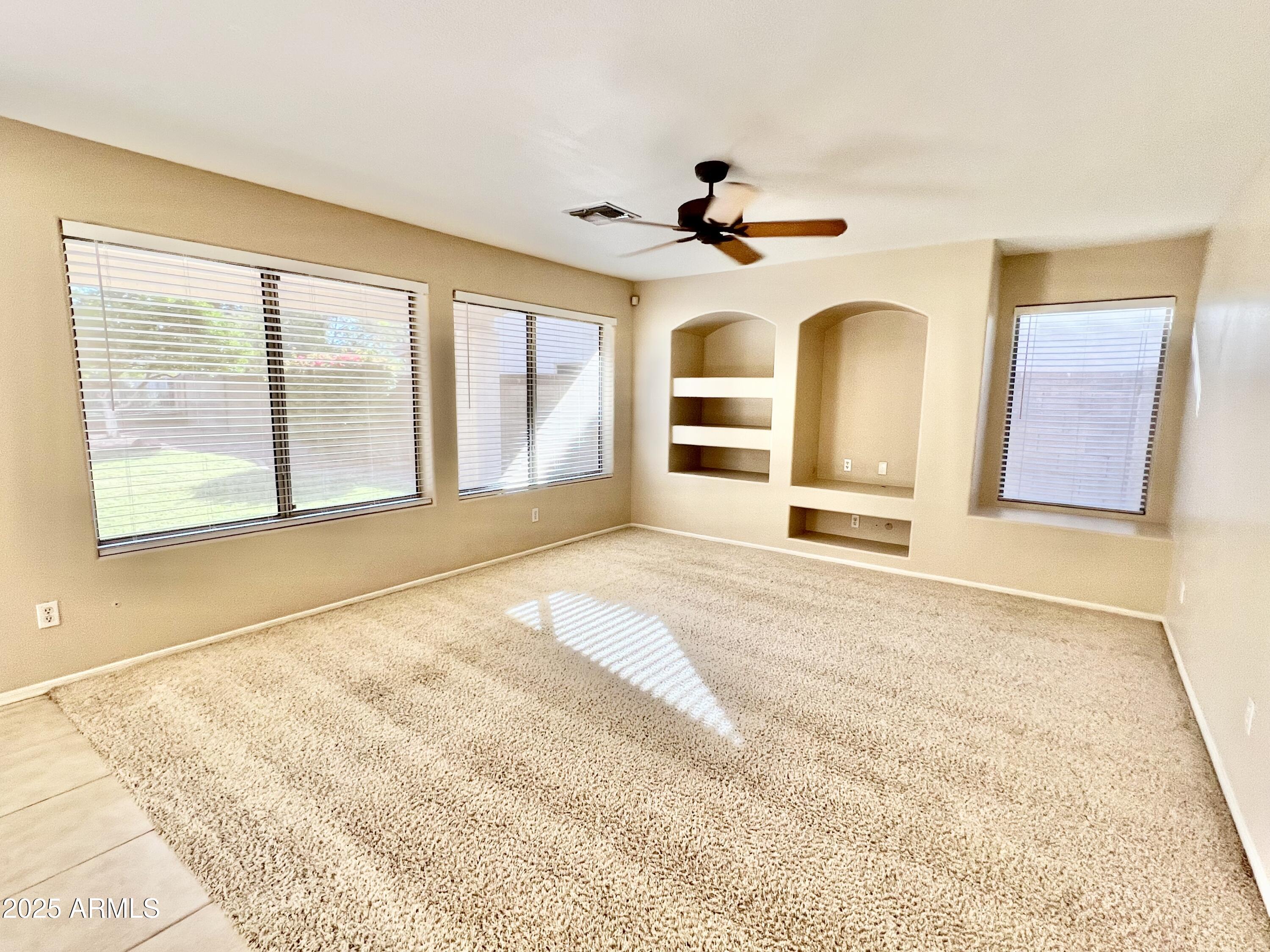 7309 West Mohawk Lane Glendale, AZ 85308 - Photo 10 of 24 a view of an empty room with a window