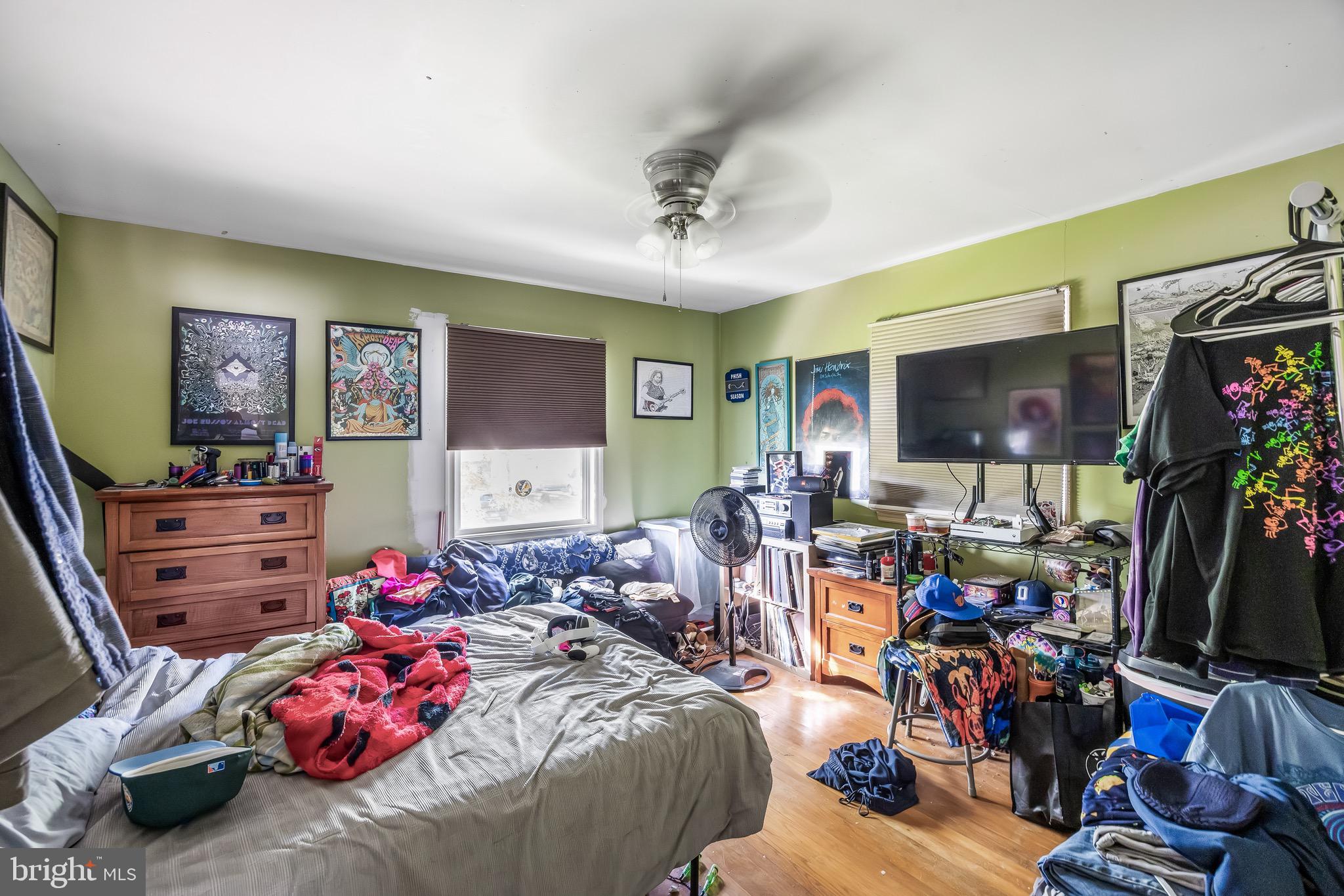109 North Ambler Road Somers Point, NJ 08244 - Photo 7 of 22 a bedroom with furniture and a flat screen tv