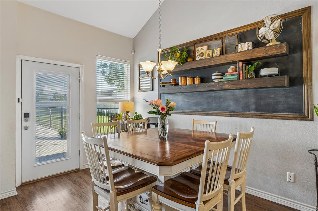 10176 Country View Lane Forney, TX 75126 - Photo 13 of 40 a dining room with furniture window and wooden floor