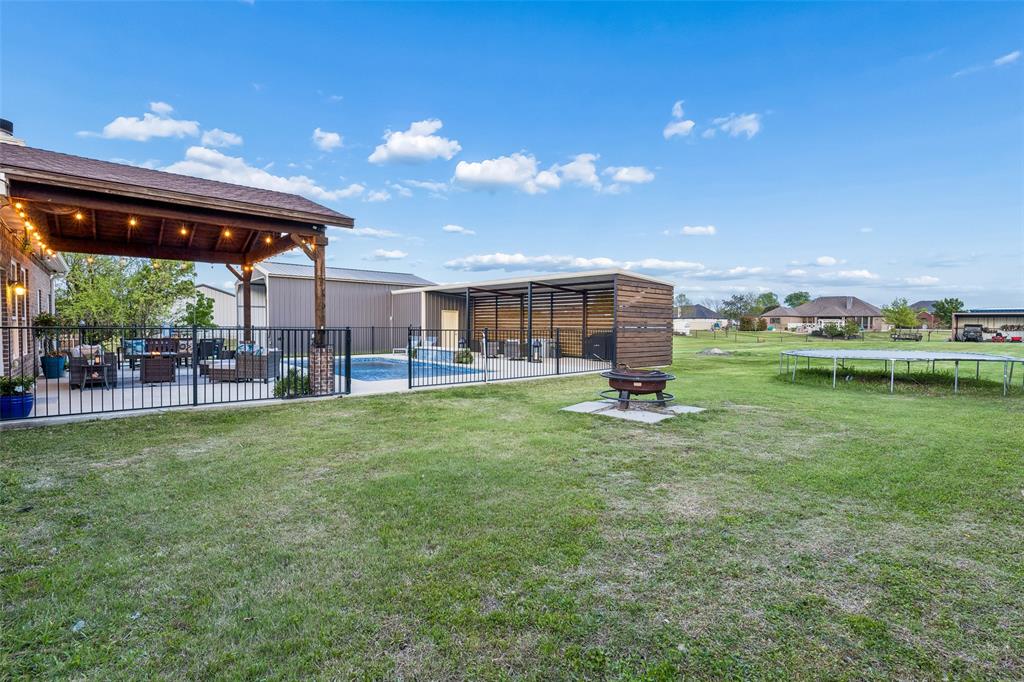 10176 Country View Lane Forney, TX 75126 - Photo 15 of 40 a view of a house with a backyard porch and sitting area