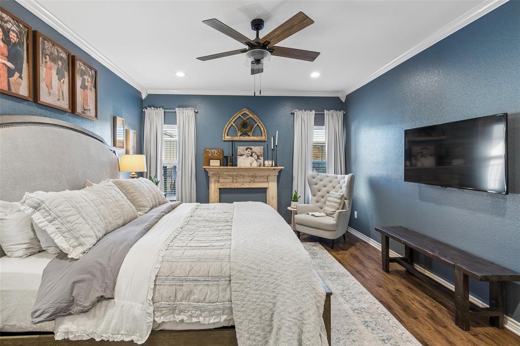 10176 Country View Lane Forney, TX 75126 - Photo 20 of 40 a bedroom with a bed and a flat tv screen on dresser