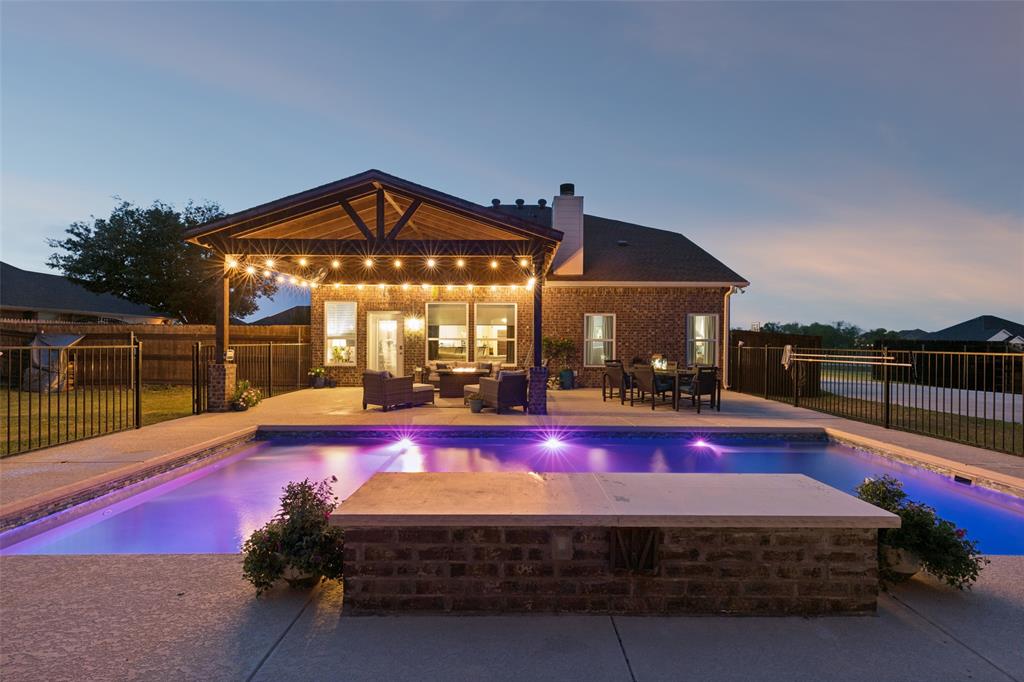 10176 Country View Lane Forney, TX 75126 - Photo 5 of 40 a view of swimming pool with seating space and yard in back
