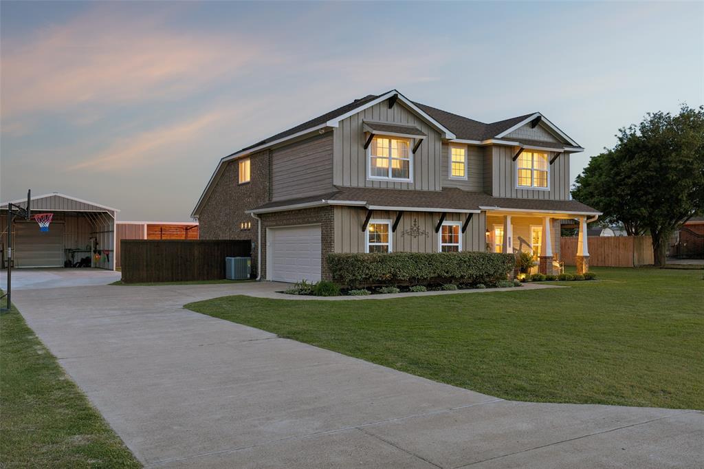 10176 Country View Lane Forney, TX 75126 - Photo 7 of 40 a front view of a house with a yard
