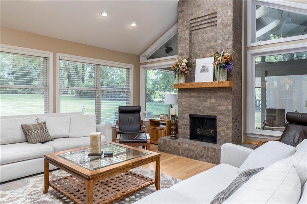 924 Old Washington Road Canonsburg, PA 15317 - Photo 13 of 46 a living room with furniture a table and a fireplace
