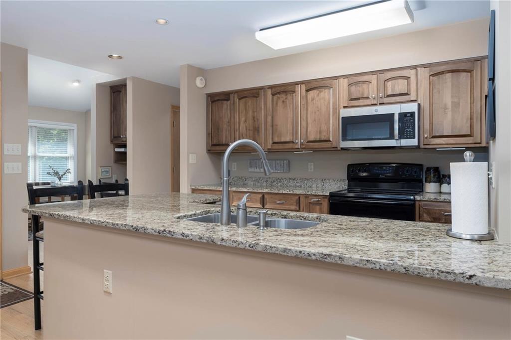 924 Old Washington Road Canonsburg, PA 15317 - Photo 18 of 46 a kitchen with granite countertop a sink and a stove top oven