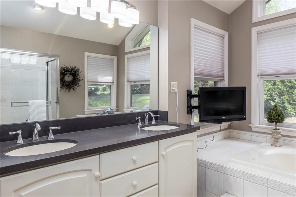 924 Old Washington Road Canonsburg, PA 15317 - Photo 23 of 46 a bathroom with double sink and a mirror
