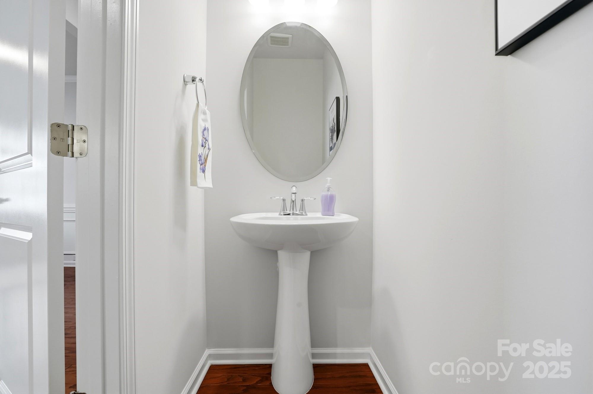 128 Van Gogh Trail Mount Holly, NC 28120 - Photo 13 of 48 a bathroom with a sink and a mirror