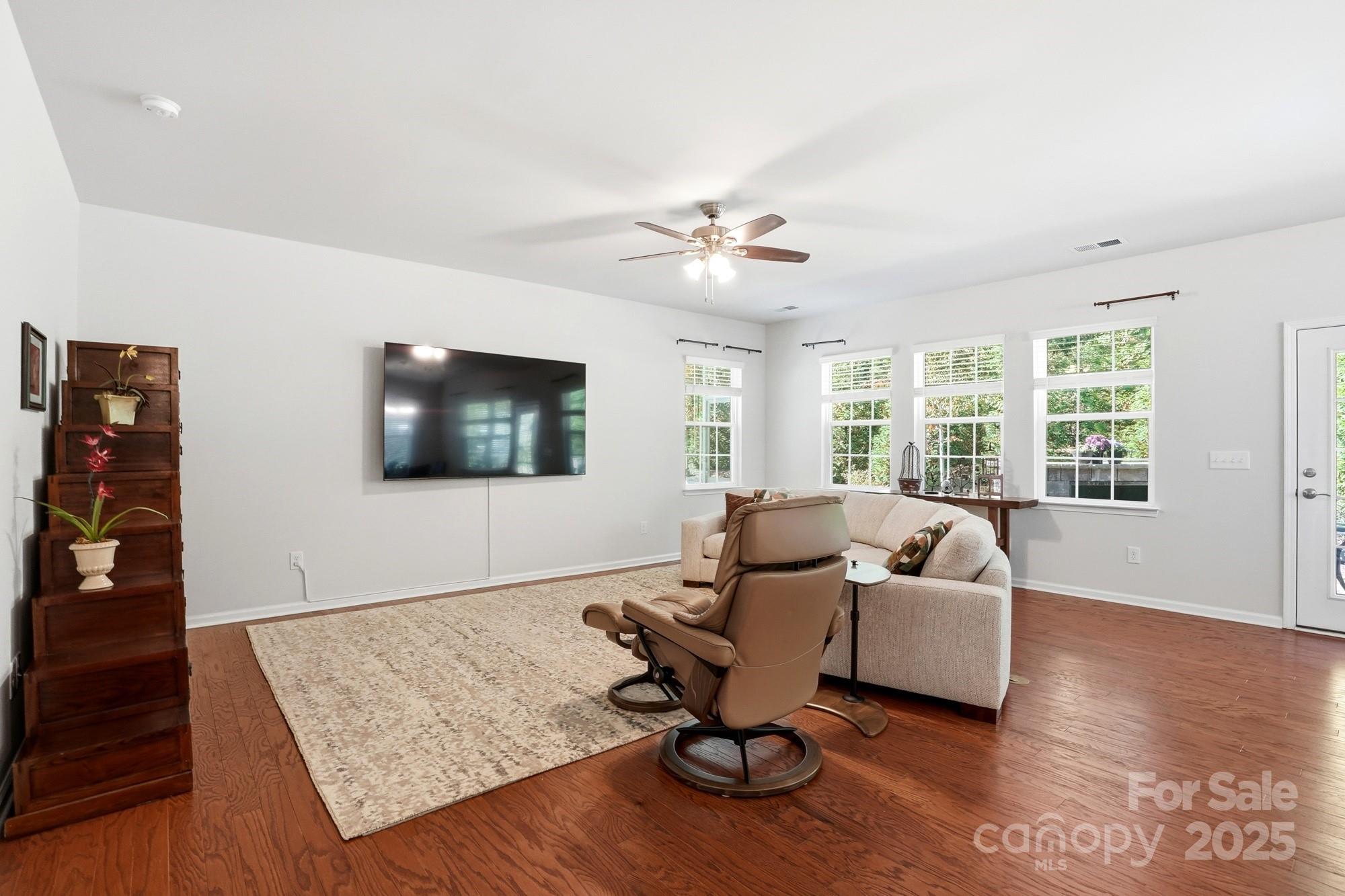 128 Van Gogh Trail Mount Holly, NC 28120 - Photo 19 of 48 a living room with furniture and a flat screen tv