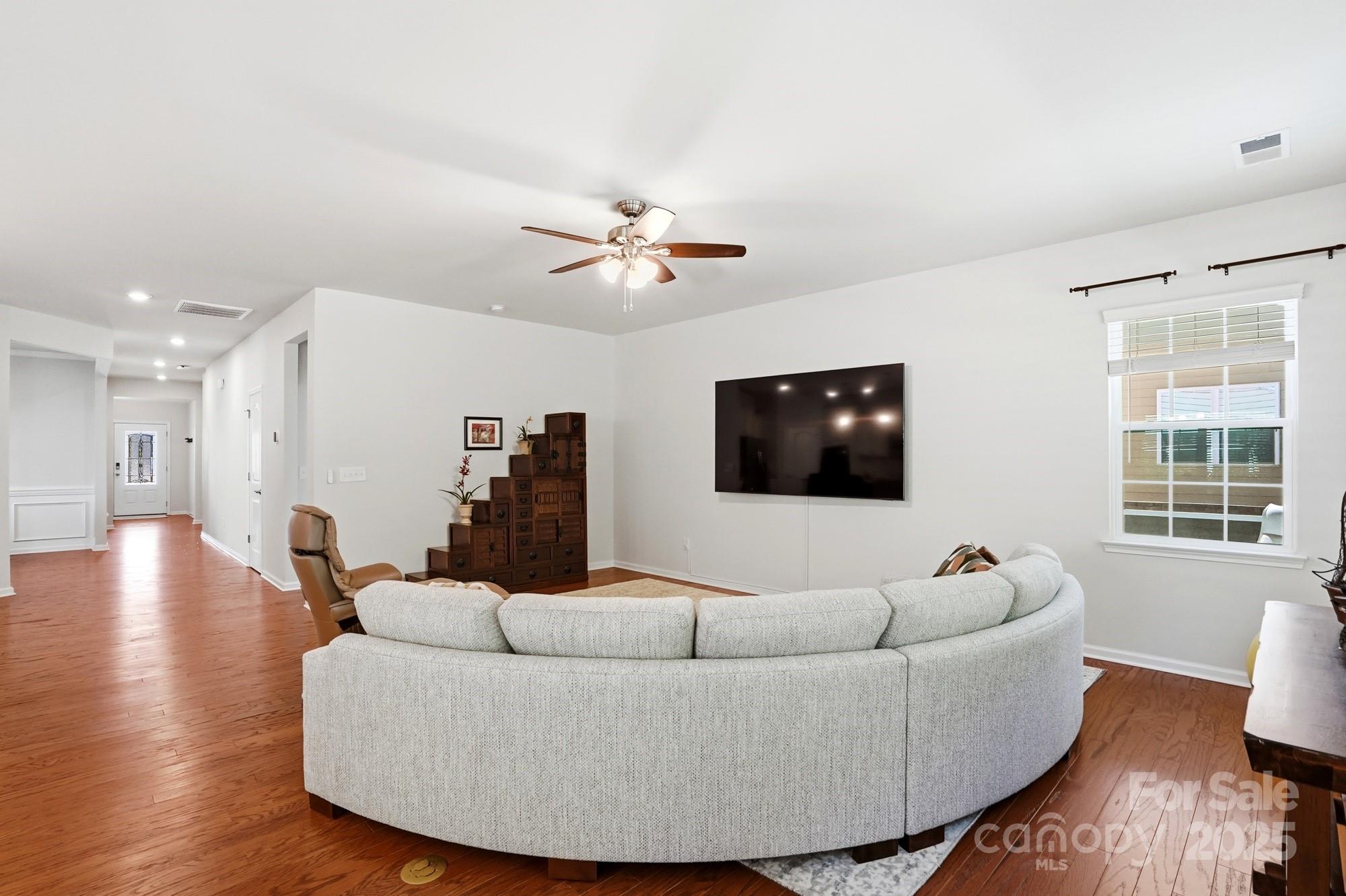 128 Van Gogh Trail Mount Holly, NC 28120 - Photo 20 of 48 a living room with furniture and a flat screen tv
