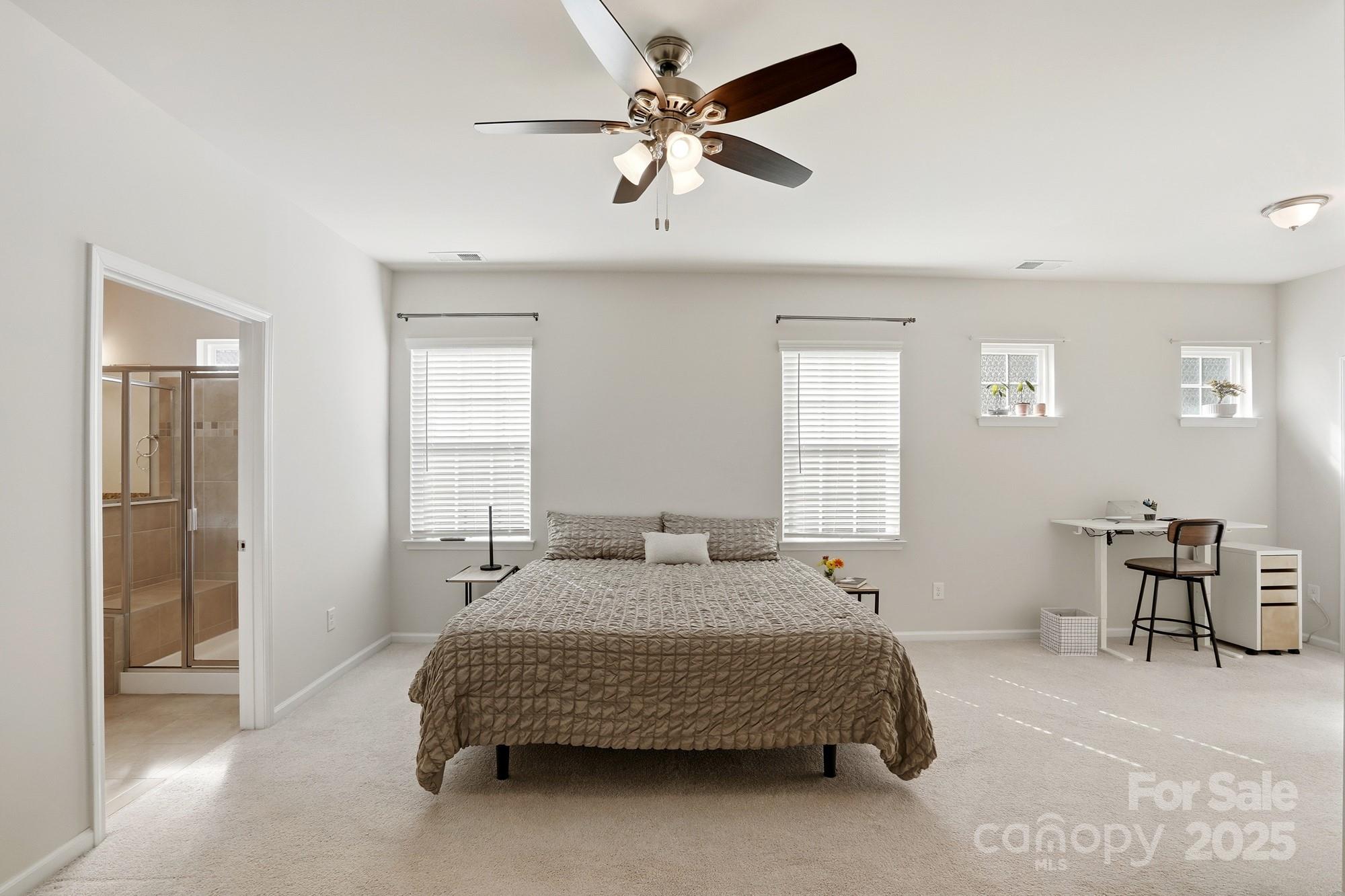 128 Van Gogh Trail Mount Holly, NC 28120 - Photo 23 of 48 a bedroom with a bed chairs and window