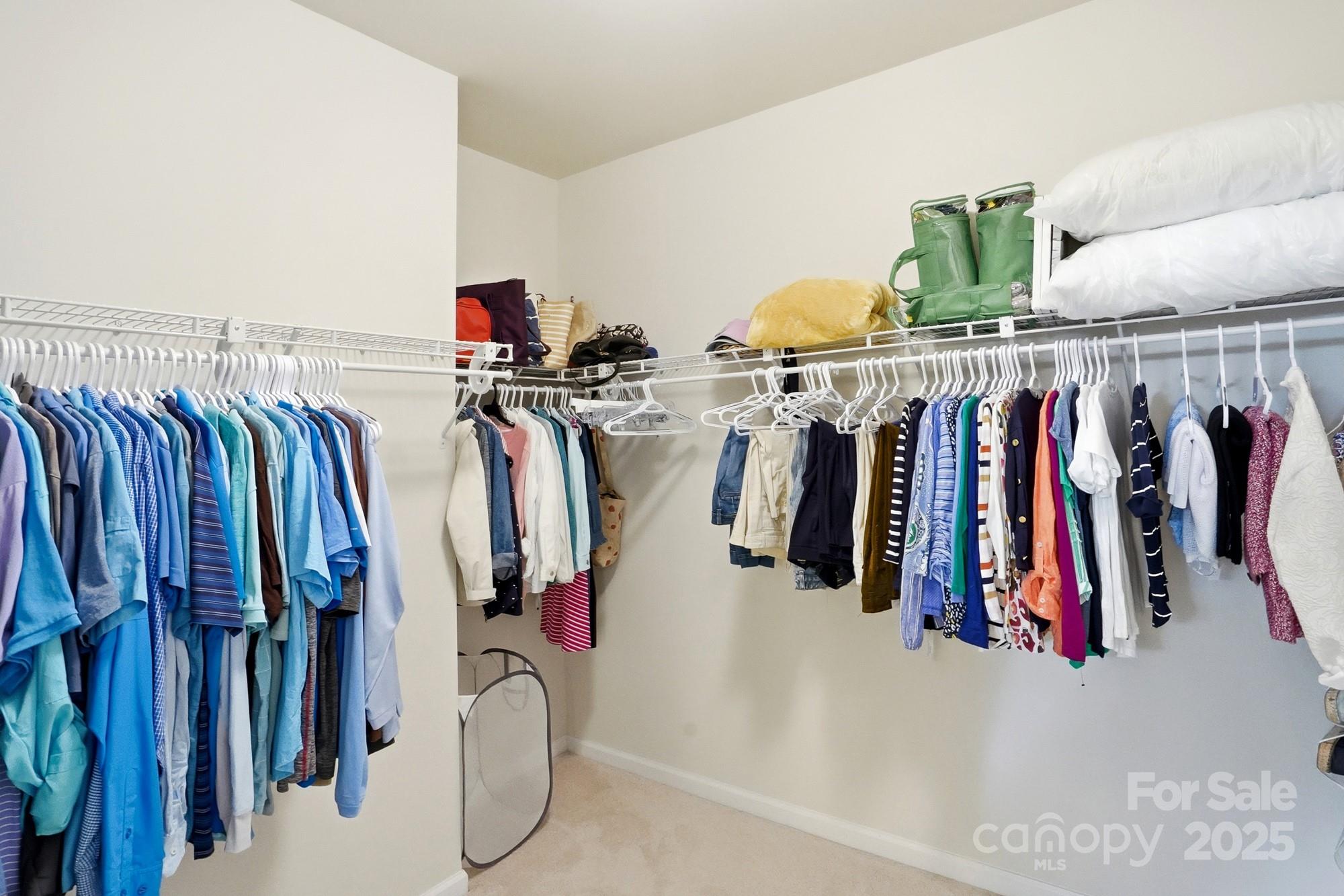 128 Van Gogh Trail Mount Holly, NC 28120 - Photo 29 of 48 a view of walk in closet with clothes
