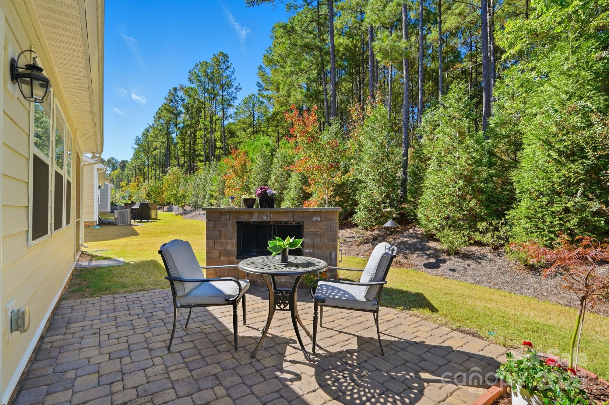 128 Van Gogh Trail Mount Holly, NC 28120 - Photo 32 of 48 a view of a chairs and table in the patio