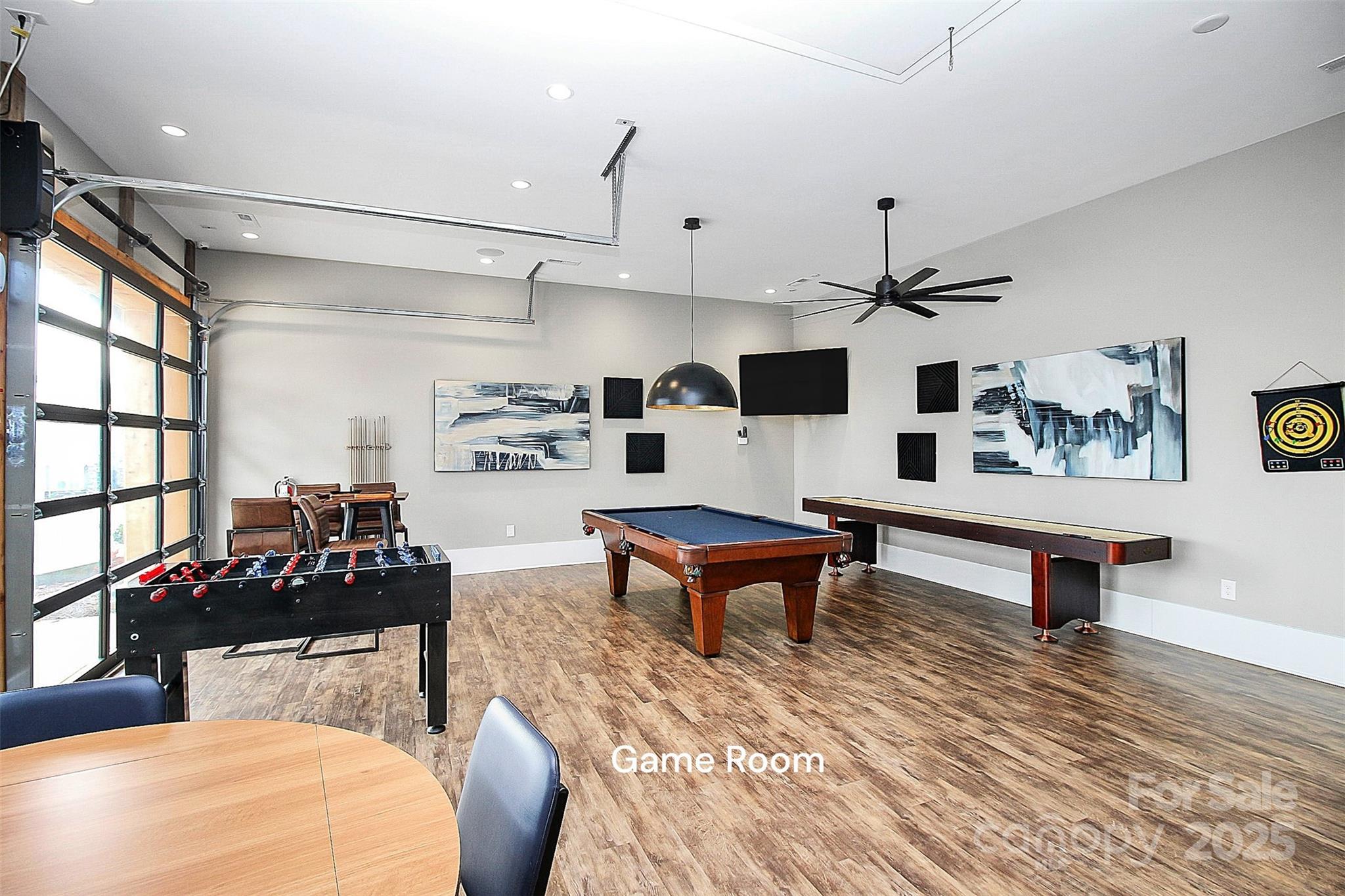 128 Van Gogh Trail Mount Holly, NC 28120 - Photo 43 of 48 a living room with furniture and a wooden floor