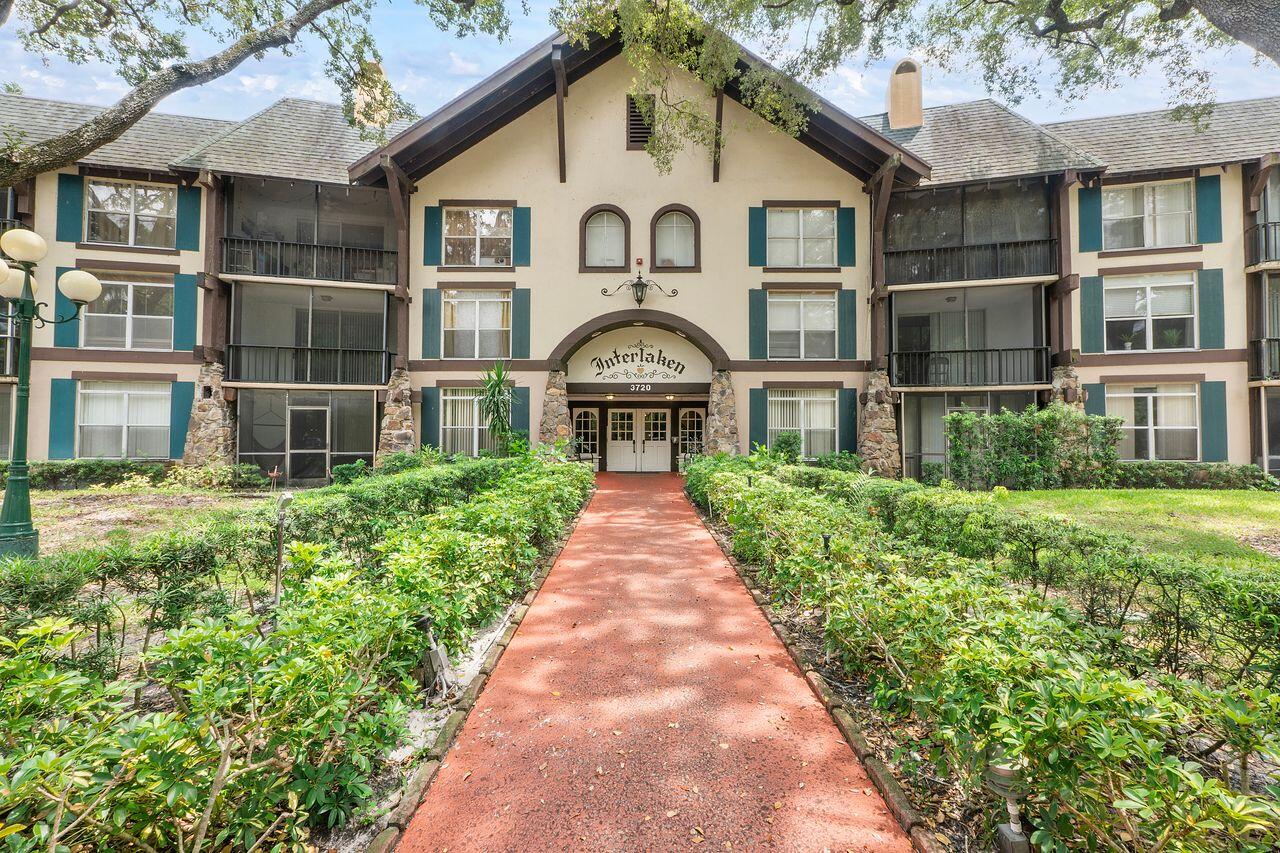 3720 Inverrary Drive, Unit 3D Lauderhill, FL 33319 - Photo 1 of 25 a front view of a house with a garden