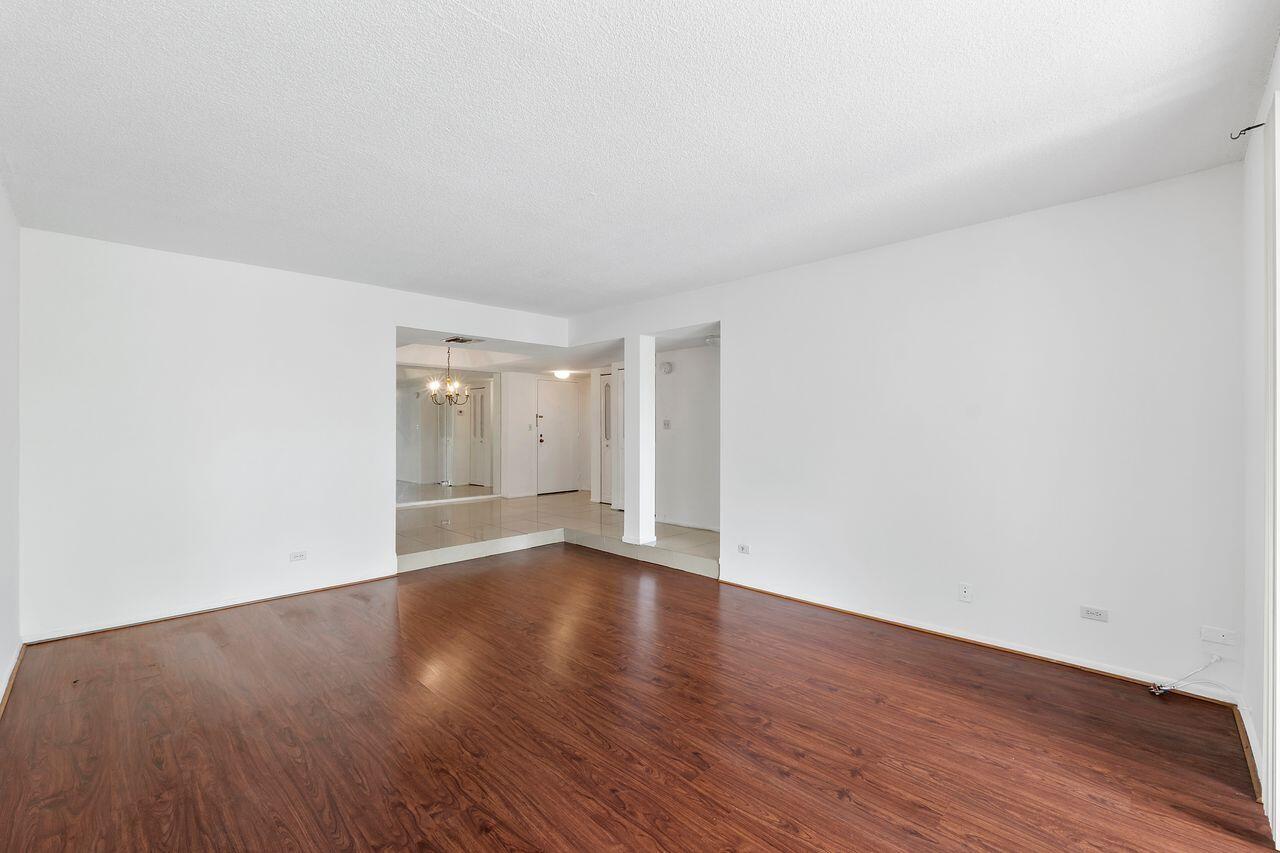 3720 Inverrary Drive, Unit 3D Lauderhill, FL 33319 - Photo 11 of 25 a view of an empty room and wooden floor
