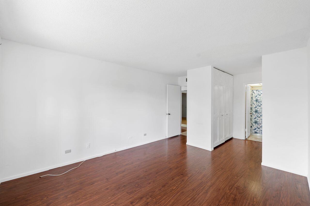 3720 Inverrary Drive, Unit 3D Lauderhill, FL 33319 - Photo 13 of 25 a view of an empty room with wooden floor