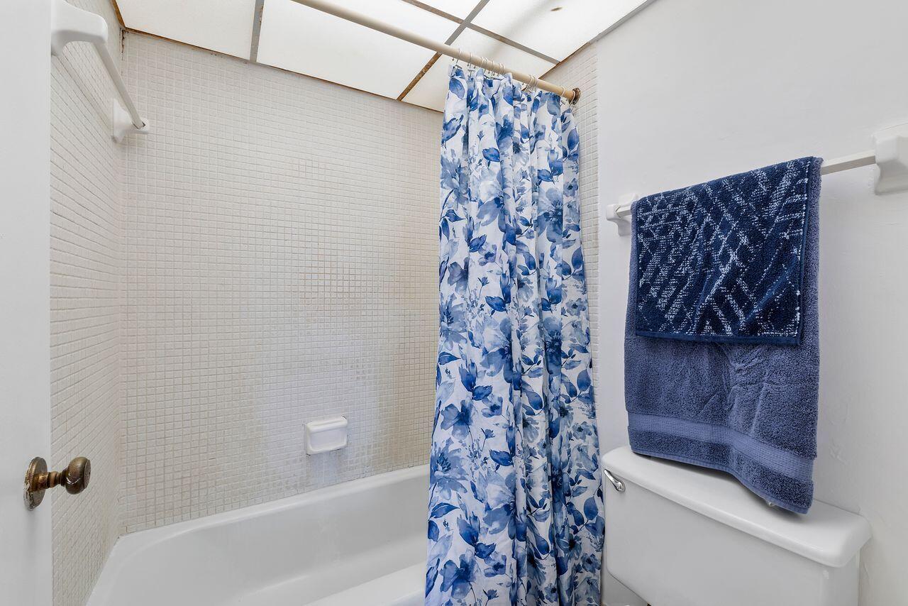3720 Inverrary Drive, Unit 3D Lauderhill, FL 33319 - Photo 17 of 25 a bathroom with a shower and a bathtub