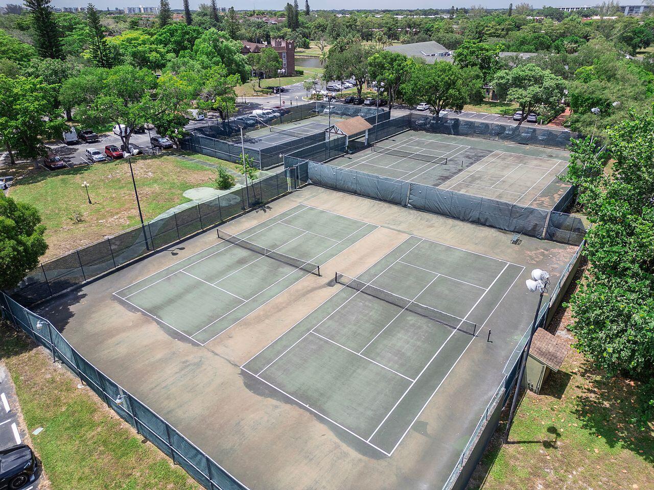 3720 Inverrary Drive, Unit 3D Lauderhill, FL 33319 - Photo 22 of 25 a view of a swimming pool with chairs