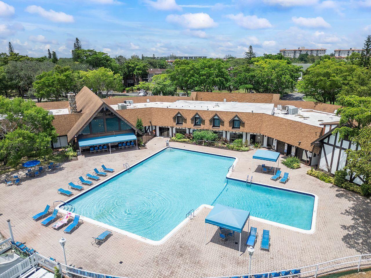 3720 Inverrary Drive, Unit 3D Lauderhill, FL 33319 - Photo 25 of 25 an aerial view of a house with a garden and lake view