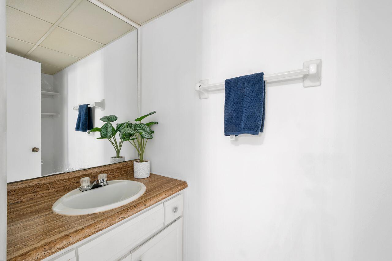 3720 Inverrary Drive, Unit 3D Lauderhill, FL 33319 - Photo 3 of 25 a bathroom with a sink and a mirror