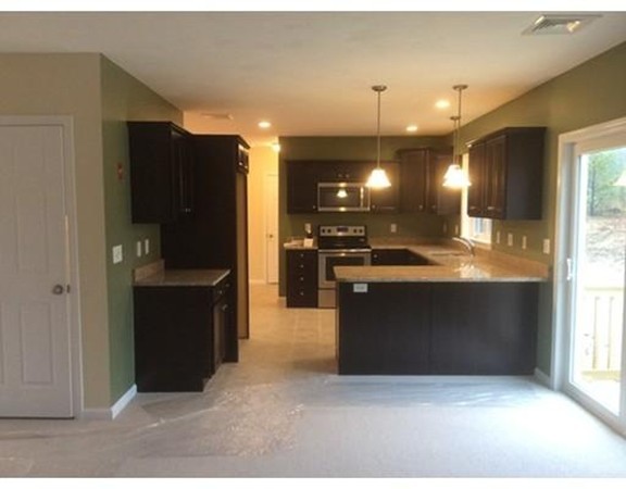 Lot 28-136 Forbes Road Rochester, MA 02770 - Photo 3 of 18 a kitchen with stainless steel appliances granite countertop a refrigerator and a sink