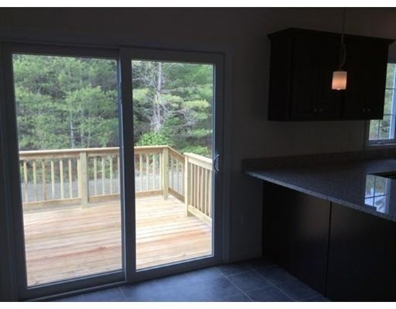 Lot 28-136 Forbes Road Rochester, MA 02770 - Photo 4 of 18 a view of an empty room with wooden floor and a window