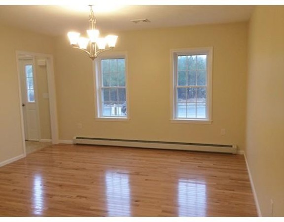 Lot 28-136 Forbes Road Rochester, MA 02770 - Photo 10 of 18 a view of an empty room with wooden floor and a window