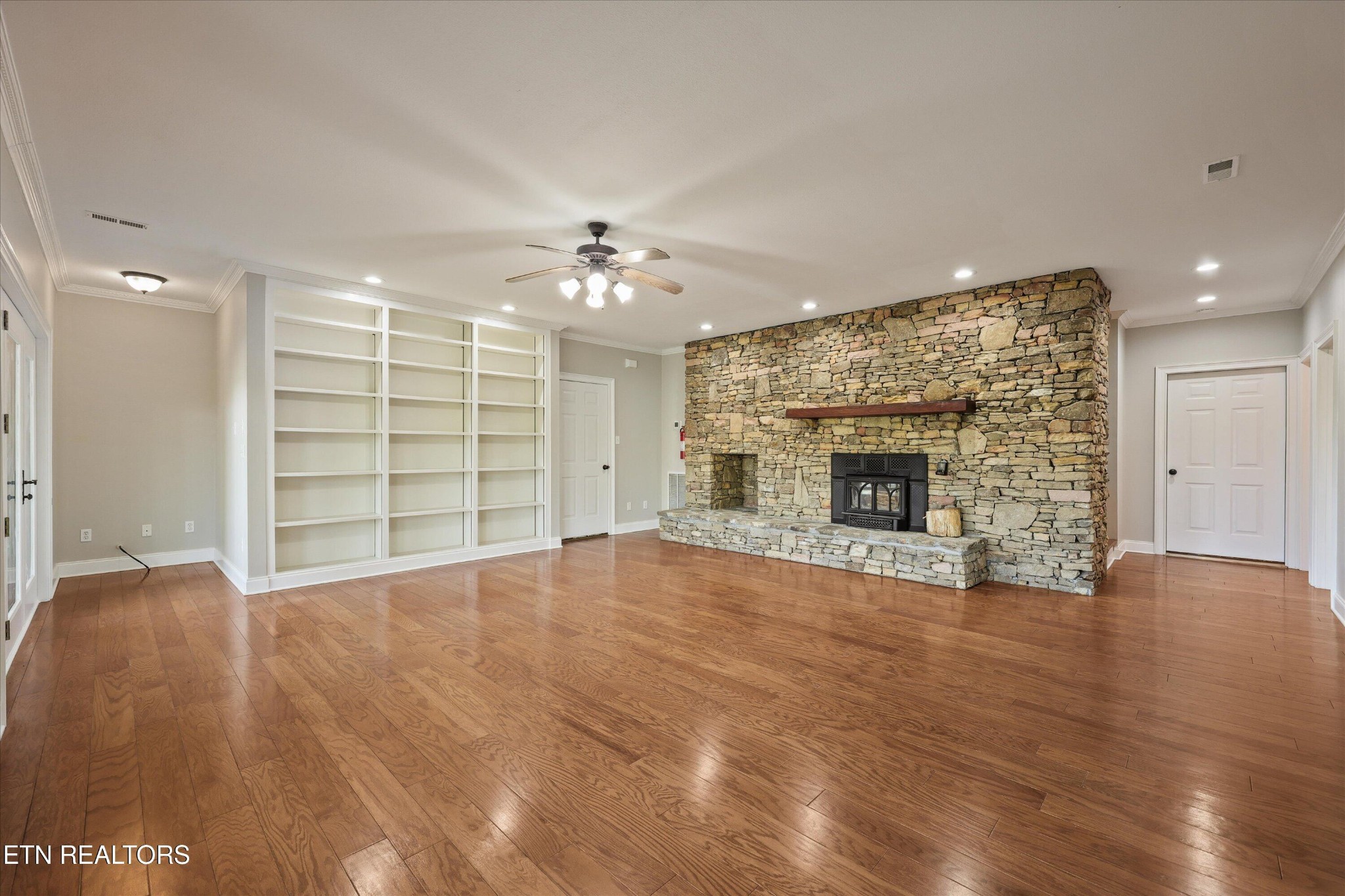 865 Stonegate Way Townsend, TN 37882 - Photo 39 of 60 a view of an empty room with a fireplace and a window