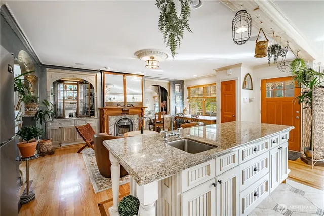 a kitchen with stainless steel appliances granite countertop a stove and a refrigerator
