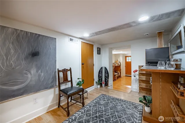 a view of a hallway with workspace and a bathroom