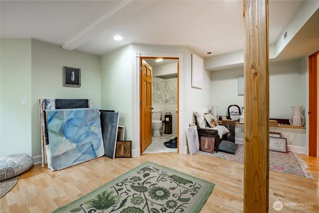 a bedroom with a bed and couch