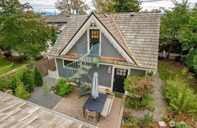 a front view of a house with garden