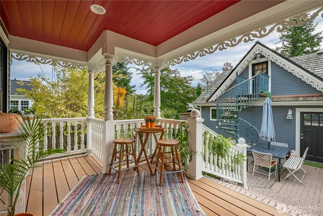 a view of a room with wooden floor and staircase