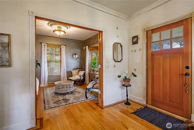 a very nice looking room with a large window and chandelier