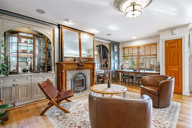 a living room filled with furniture and a floor to ceiling window