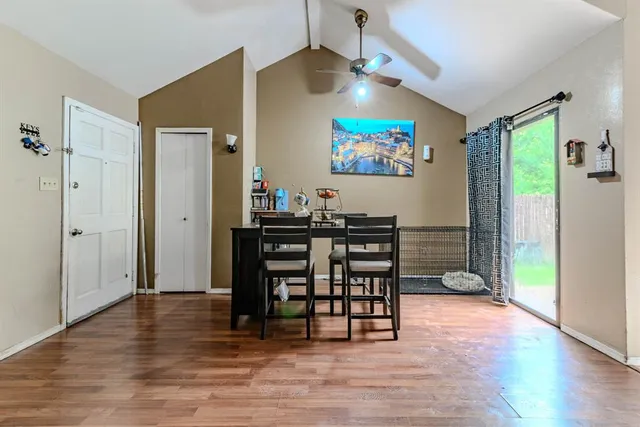 a view of a livingroom with furniture and a flat screen tv