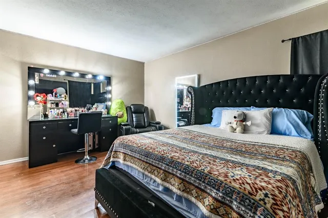 a bedroom with a bed and dresser