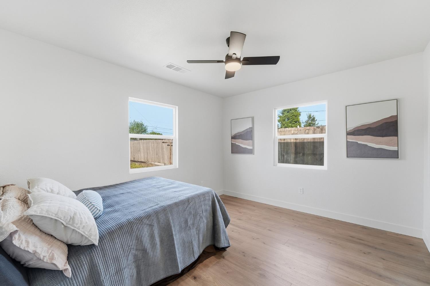 430 Laurel Avenue Modesto, CA 95351 - Photo 12 of 28 a bedroom with a bed and a window
